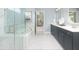 Luxurious bathroom with double vanity, soaking tub, and glass shower at 2082 Cousteau Ct, Johns Island, SC 29455