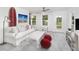 Bright bonus room with comfy sofa and access to balcony at 2082 Cousteau Ct, Johns Island, SC 29455