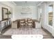 Formal dining room featuring a wood table and large windows at 2082 Cousteau Ct, Johns Island, SC 29455