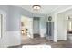 Bright foyer with wood floors, bench, and French doors at 2082 Cousteau Ct, Johns Island, SC 29455