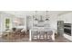 Modern kitchen with white cabinets, granite counters, and island at 2082 Cousteau Ct, Johns Island, SC 29455