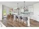 Modern kitchen with white cabinets, granite counters, and island at 2082 Cousteau Ct, Johns Island, SC 29455