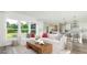 Open living room with comfy sofas and view to the kitchen at 2082 Cousteau Ct, Johns Island, SC 29455