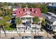 Multi-unit house with red roof and white fence, aerial view at 212 Calhoun, Charleston, SC 29401