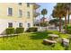 Small grassy backyard with a stone table and bike rack at 212 Calhoun, Charleston, SC 29401