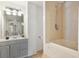 Bathroom with a shower/tub combo and gray vanity at 212 Calhoun, Charleston, SC 29401