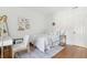 Charming bedroom with hardwood floors, a cozy bed and window at 212 Calhoun, Charleston, SC 29401