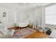 Bright bedroom with hardwood floors, a comfy bed, and a large window at 212 Calhoun, Charleston, SC 29401