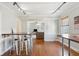 Open concept dining area with hardwood floors and view into living room at 212 Calhoun, Charleston, SC 29401