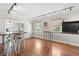 Bright dining area with wood floors, wooden table, and metal chairs at 212 Calhoun, Charleston, SC 29401