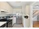 Kitchen with stainless steel appliances and view into hallway at 212 Calhoun, Charleston, SC 29401