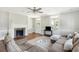 Relaxing living room with hardwood floors, sectional sofa, fireplace, and access to porch at 212 Calhoun, Charleston, SC 29401