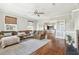 Spacious living room with hardwood floors, a cozy sectional sofa and fireplace at 212 Calhoun, Charleston, SC 29401