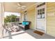 Cozy porch with wicker furniture, creating a relaxing outdoor space at 212 Calhoun, Charleston, SC 29401