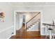 Staircase with hardwood floors and wooden railing at 212 Calhoun, Charleston, SC 29401
