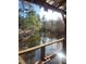 Serene view of a calm lake from a wooden deck at 218 Cat Hole Ln, Branchville, SC 29432