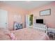 Another bedroom with pink walls, a white bed, and built-in shelving at 2202 St Johns Woods Pkwy, Johns Island, SC 29455