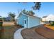 Small light blue detached garage with white door at 2202 St Johns Woods Pkwy, Johns Island, SC 29455