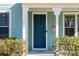 Blue front door with a wreath, on a light blue house at 2202 St Johns Woods Pkwy, Johns Island, SC 29455