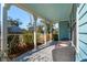 Spacious front porch with wicker chairs, offering a tranquil setting at 2202 St Johns Woods Pkwy, Johns Island, SC 29455