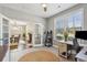 Home office with French doors opening to dining area at 2202 St Johns Woods Pkwy, Johns Island, SC 29455