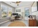 Bright home office features wood flooring and built-in workspace at 2202 St Johns Woods Pkwy, Johns Island, SC 29455