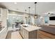 Open concept kitchen with an island that overlooks the living room at 2202 St Johns Woods Pkwy, Johns Island, SC 29455
