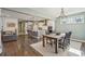 Open kitchen with island, modern appliances, and adjacent dining area at 2202 St Johns Woods Pkwy, Johns Island, SC 29455