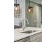 Kitchen island with white quartz countertop and stainless steel sink at 2202 St Johns Woods Pkwy, Johns Island, SC 29455