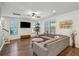 Spacious living room with L-shaped sectional sofa and wood-look floors at 2202 St Johns Woods Pkwy, Johns Island, SC 29455