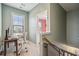 Upstairs office space with a window, desk, and a view of a pink hallway at 2202 St Johns Woods Pkwy, Johns Island, SC 29455