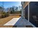 Back patio with light-grey tile and access to the screened porch at 2202 St Johns Woods Pkwy, Johns Island, SC 29455