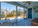Screened porch with ceiling fan, outdoor seating, and a view of the backyard at 2202 St Johns Woods Pkwy, Johns Island, SC 29455