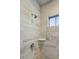 Shower with grey tile and built-in corner shelf at 2202 St Johns Woods Pkwy, Johns Island, SC 29455