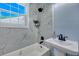 Renovated bathroom features a marble shower, pedestal sink, and a bathtub at 2268 Bailey Dr, North Charleston, SC 29405