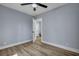 Spacious bedroom with hardwood floors and an open door to another room at 2268 Bailey Dr, North Charleston, SC 29405