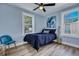 Bedroom with blue walls, double bed, and ceiling fan at 2268 Bailey Dr, North Charleston, SC 29405