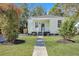 Charming light green house with white trim and a walkway at 2268 Bailey Dr, North Charleston, SC 29405