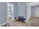 Light blue hallway with bench and view of updated bathroom at 2268 Bailey Dr, North Charleston, SC 29405