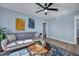 Living room with gray sofa, coffee table, and blue walls at 2268 Bailey Dr, North Charleston, SC 29405