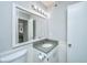 Bathroom features a gray vanity, large mirror and updated toilet at 2311 Tall Sail Dr # B, Charleston, SC 29414