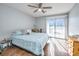 Bedroom with a ceiling fan, sliding glass doors, and dresser at 2311 Tall Sail Dr # B, Charleston, SC 29414