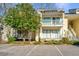 Front view of a yellow two-story condo with balconies at 2311 Tall Sail Dr # B, Charleston, SC 29414