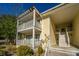 Two-story building with balconies and wooden stairs at 2311 Tall Sail Dr # B, Charleston, SC 29414