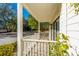 Covered porch with white railings and view of trees at 2311 Tall Sail Dr # B, Charleston, SC 29414