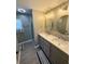 Updated bathroom with double vanity, frameless shower, and stylish tile at 235 Blossom St, Goose Creek, SC 29445