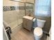 Updated bathroom with a tub shower, new vanity, and tile floors at 235 Blossom St, Goose Creek, SC 29445