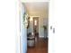 Bright and airy entryway with hardwood floors and view of bathroom at 235 Blossom St, Goose Creek, SC 29445