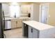 Modern kitchen with light gray cabinets, quartz countertops, and stainless steel appliances at 235 Blossom St, Goose Creek, SC 29445
