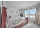 Comfortable bedroom with a wooden bed frame and large windows at 261 Firewheel Ct, Summerville, SC 29486